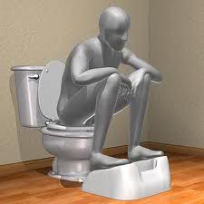 Sitting on toilet